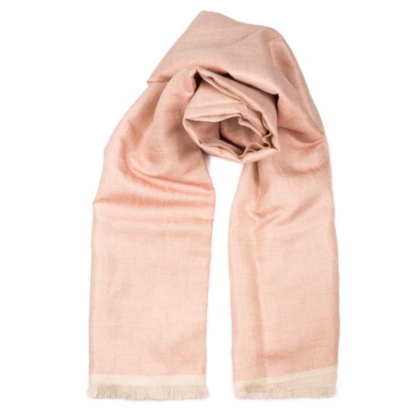 The cashmere Dorukha shawl is a double sided handwoven scarf. It has shimmery threads on one side & pearly pink solid on the reverse. From Beshlie Mckelvie.