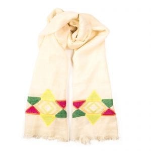 North star shawl bursts with a rainbow star and is color set on a white background. Made up of luxurious lightweight Pashmina, the scarf is hand woven. From Beshlie Mckelvie.