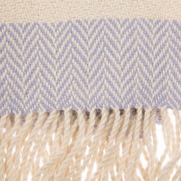 Close up detail of soft and beautiful cream alpaca shawl, the perfect accompaniment to any outfit. This natural tone alpaca scarf is hand woven, luxurious, and warm. Fair trade scarves from Beshlie McKelvie