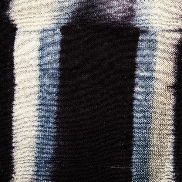 Close up detail of beautiful 100% silk scarf dyed using one of the oldest techniques from Japan, Shibori. Deep tones are indigo blue and cream. Made by local women in Laos, when buying this scarf from Beshlie you will be directly supporting them and helping to continue their work and traditions. Laos is an ethnically diverse country with unique textile traditions. Our support of local womens co-operatives focuses on taking care of the environment, honouring and respecting traditions, and paying good wages. Buy fair trade today.