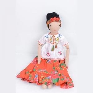 Eco friendly Frida doll comes dressed in a colourful, orange patterned skirt and white blouse. Handcrafted in India by women refugees from Afghanistan.