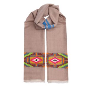 The hand woven fire cashmere scarf comes in a warm biscuit colour and has a stunning and unique colourful design adorning the ends. Support ethical fashion.