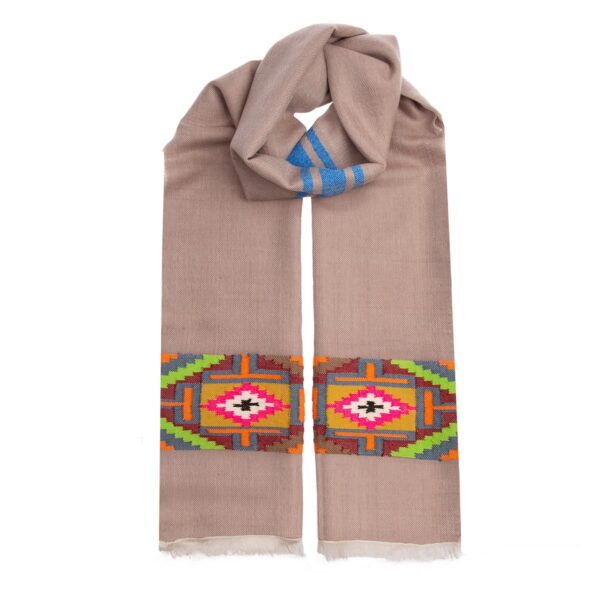 The hand woven fire cashmere scarf comes in a warm biscuit colour and has a stunning and unique colourful design adorning the ends. Support ethical fashion.