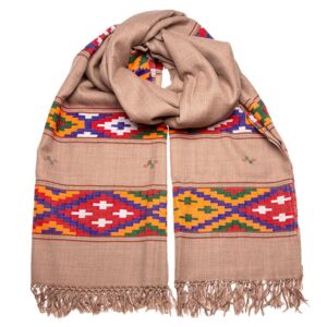 Traditionally hand woven scarf in merino wool with bold coloured motif over a fawn base colour. Keep warm through the winter months.
