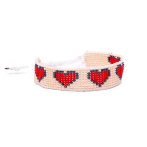 Handmade Huichol beaded bracelet with a red heart design. Made in Mexico using traditional techniques to weave together tiny beads in a unique combination.