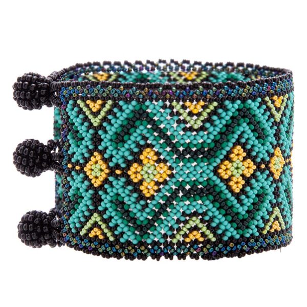 Primavera Dorada, a Huichol bracelet adorned with yellow flowers & intricate shades of green. Fair Trade Handcrafted beauty.