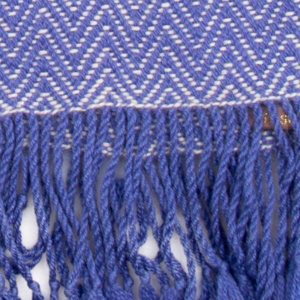 Cornflower blue alpaca wool scarf with a zig-zag pattern, handcrafted by women artisans. Close up details
