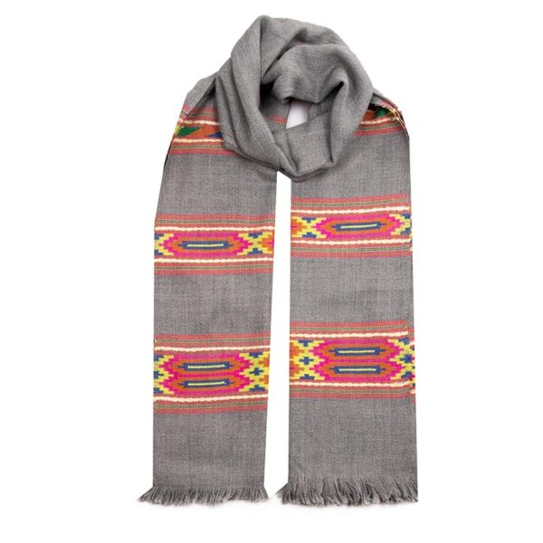 Kulu Cashmere scarf in soft grey, intricately handwoven with vibrant traditional patterns.